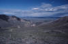 Look west at the ghost town of Bannock. It is an old arsenic district and a modern placer gold district.