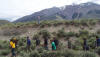 Don Fisher and the class traverse in opposite directions at the Borah fault scarp