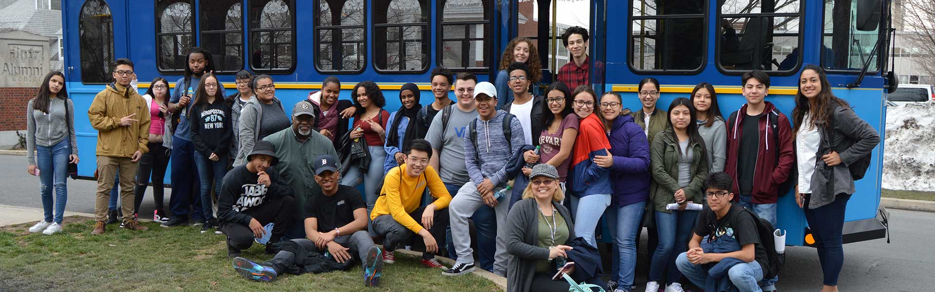 students getting on a bus