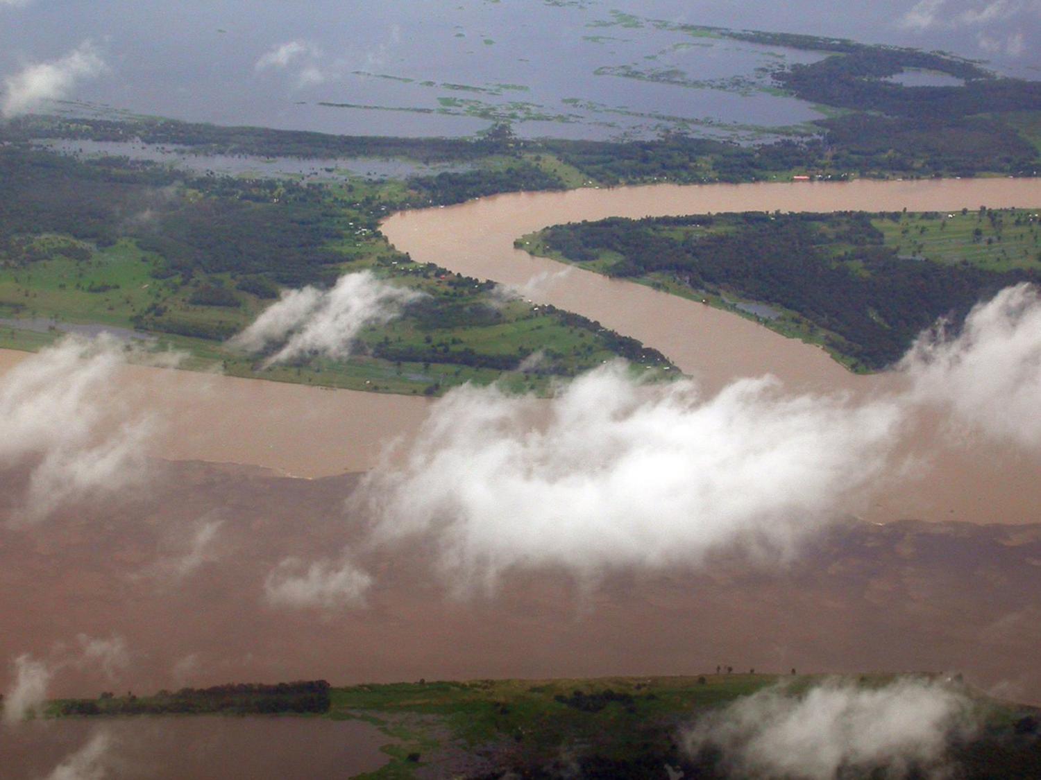 aerial view of a dirt road, clouds