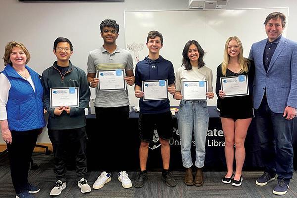 Kimlyn and John, Jr. Patishnock with University Libraries Research Award winners